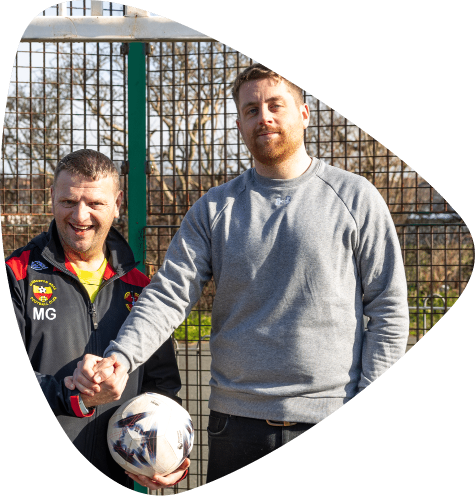 Elliots Hill worker playing football with client